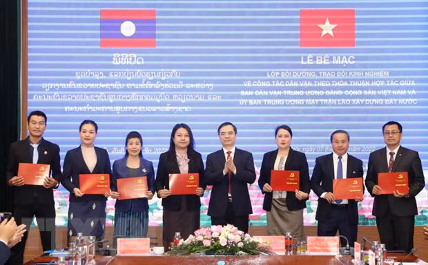Vietnam et Laos partagent d'expériences liées à la mobilisation des masses ảnh 1