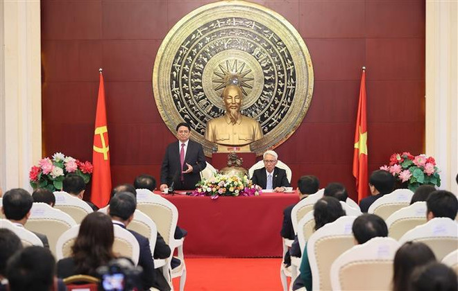 Le PM rencontre la communauté vietnamienne en Chine ảnh 2