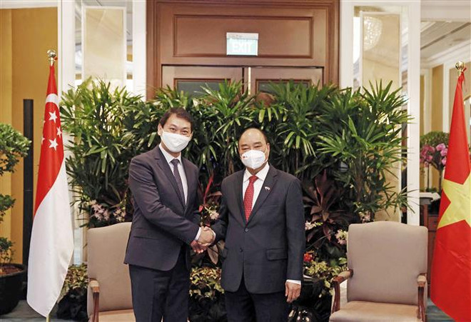 Le président Nguyen Xuan Phuc rencontre des entreprises singapouriennes ảnh 4