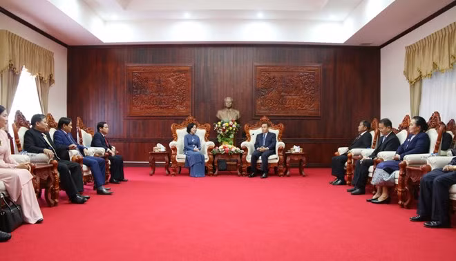 Le Vietnam et le Laos partagent leur expérience sur la mobilisation des masses ảnh 1