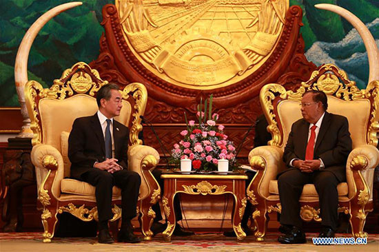 Le secrétaire général du PPRL et président laotien reçoit le ministre chinois des AE ảnh 1 Le secrétaire général du PPRL et président laotien reçoit le ministre chinois des AE ảnh 1