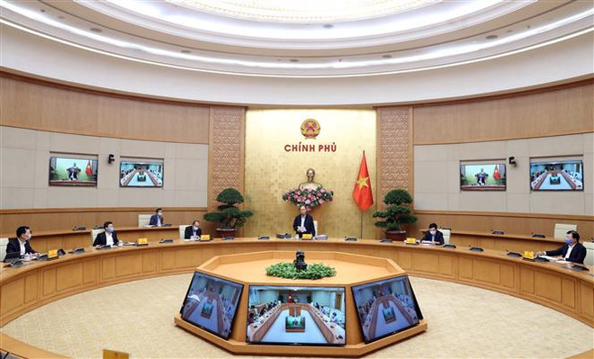 Le PM préside une séance de travail sur la lutte contre l’épidémie de coronavirus ảnh 1 Le PM préside une séance de travail sur la lutte contre l’épidémie de coronavirus ảnh 1