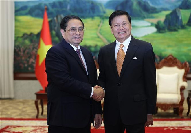 Le PM Pham Minh Chinh rencontre le secrétaire général du Parti et président du Laos ảnh 1 Le PM Pham Minh Chinh rencontre le secrétaire général du Parti et président du Laos ảnh 1