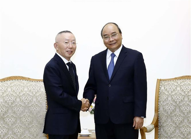 Le Premier ministre reçoit le PDG du groupe japonais Fast Retailing ảnh 1 Le Premier ministre reçoit le PDG du groupe japonais Fast Retailing ảnh 1