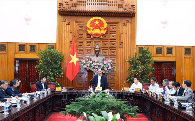 Le PM travaille avec des ministères pour l’accélération de l'achat de riz ảnh 1