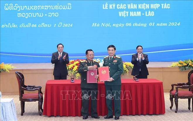 Entretien entre les Premiers ministres du Vietnam et du Laos ảnh 3 Entretien entre les Premiers ministres du Vietnam et du Laos ảnh 3
