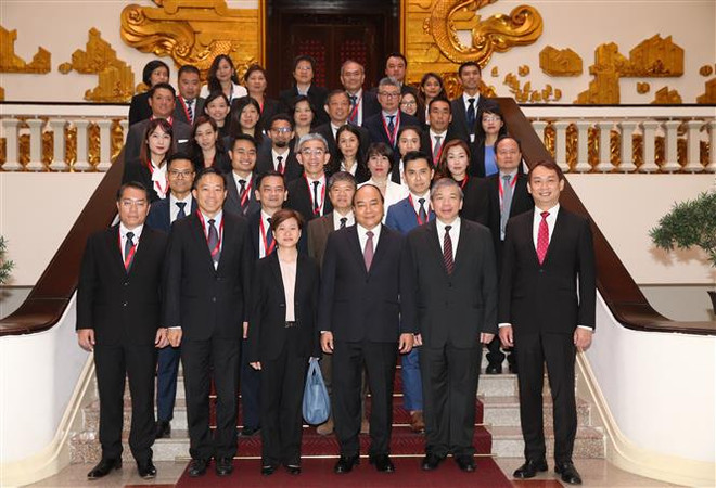 Le PM reçoit des hommes d’affaires singapouriens ảnh 1 Le PM reçoit des hommes d’affaires singapouriens ảnh 1