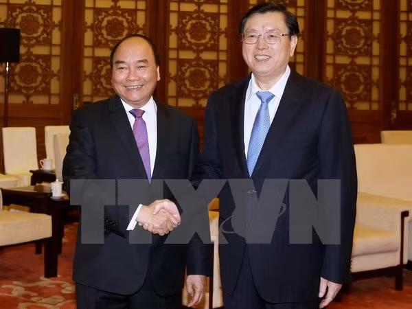 Activités du Premier ministre Nguyen Xuan Phuc à Pékin ảnh 1
