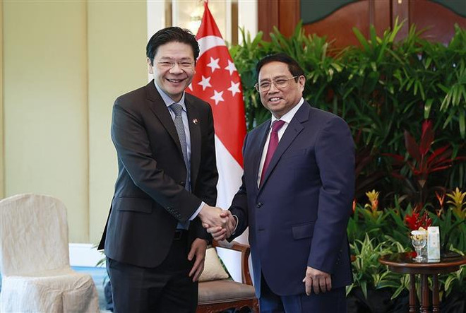 Le PM Pham Minh Chinh reçoit un vice-Premier ministre singapourien ảnh 1 Le PM Pham Minh Chinh reçoit un vice-Premier ministre singapourien ảnh 1