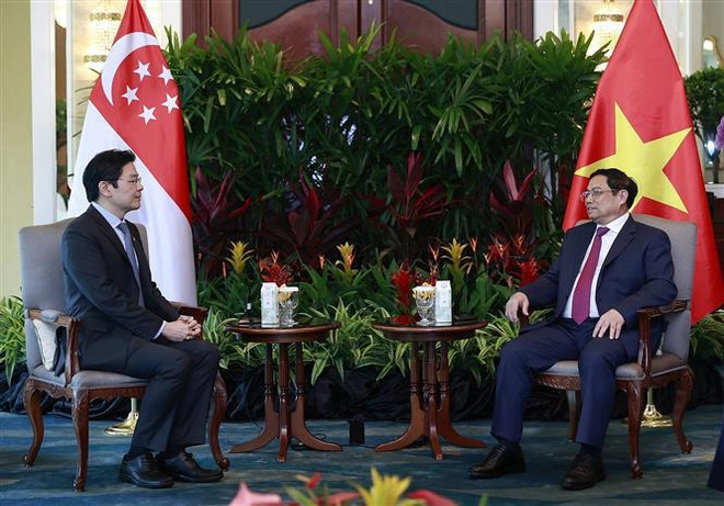 Le PM Pham Minh Chinh reçoit un vice-Premier ministre singapourien ảnh 2 Le PM Pham Minh Chinh reçoit un vice-Premier ministre singapourien ảnh 2