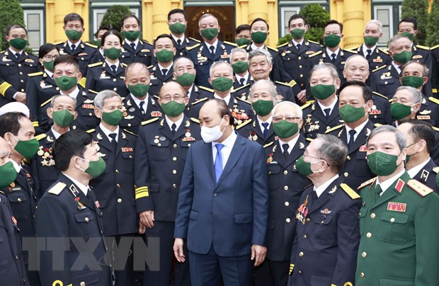 Le président Nguyen Xuan Phuc rencontre des anciens combattants de la piste maritime Ho Chi Minh ảnh 1 Le président Nguyen Xuan Phuc rencontre des anciens combattants de la piste maritime Ho Chi Minh ảnh 1