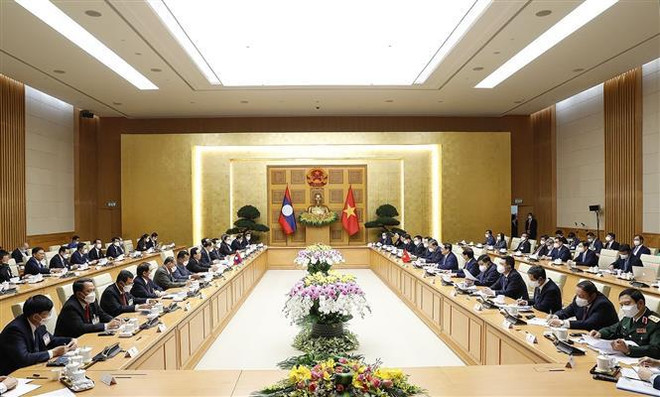 Entretien entre les Premiers ministres du Vietnam et du Laos ảnh 1 Entretien entre les Premiers ministres du Vietnam et du Laos ảnh 1