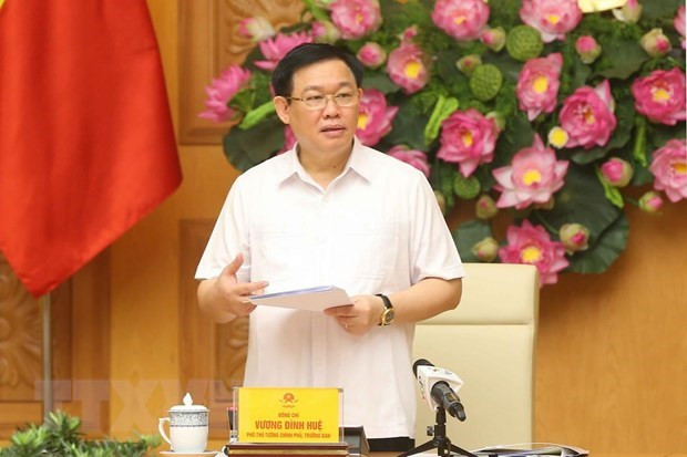Le vice-PM Vuong Dinh Hue examine l'actionnarisation et la restructuration des entreprises publiques ảnh 1