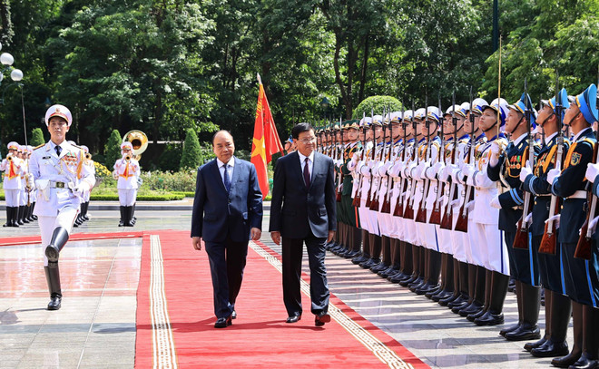 Cérémonie d’accueil du SG du Parti et président du Laos en visite d’amitié officielle au Vietnam ảnh 1 Cérémonie d’accueil du SG du Parti et président du Laos en visite d’amitié officielle au Vietnam ảnh 1