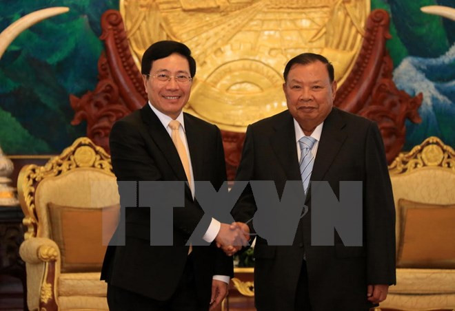 Le vice-PM et ministre des AE Pham Binh Minh en visite officielle au Laos ảnh 1 Le vice-PM et ministre des AE Pham Binh Minh en visite officielle au Laos ảnh 1