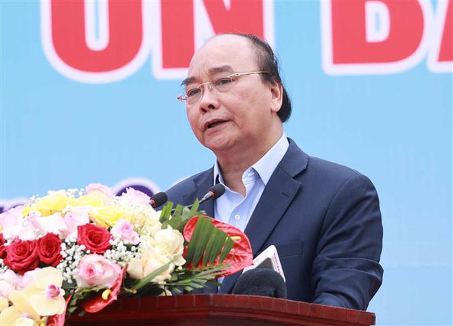 Le président Nguyen Xuan Phuc à une cérémonie de plantation d’arbres à Hanoï ảnh 1