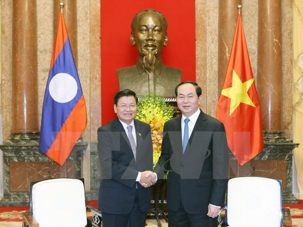 Le président vietnamien reçoit le PM laotien ảnh 1 Le président vietnamien reçoit le PM laotien ảnh 1
