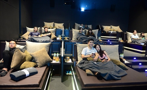 Cinéma au lit : un nouveau loisir au Vietnam ảnh 1 Cinéma au lit : un nouveau loisir au Vietnam ảnh 1