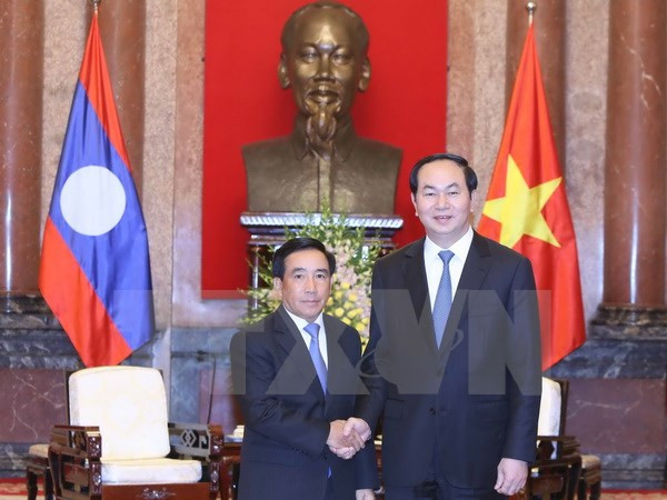 Le président Trân Dai Quang reçoit le vice-président laotien Phankham Viphavanh ảnh 1