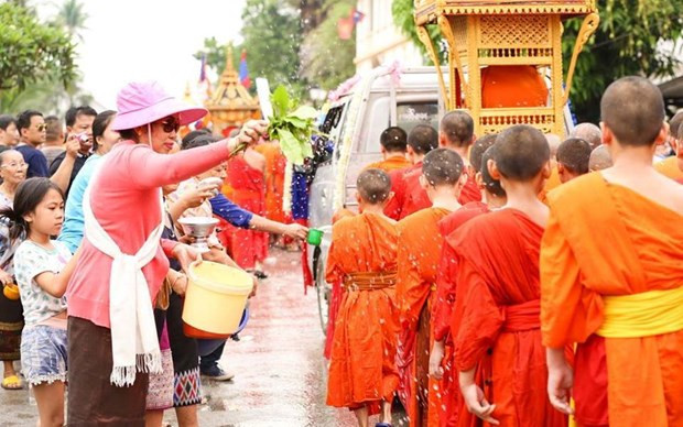 Les diplomates vietnamiens à Genève félicitent leurs homologues lao pour le Nouvel An lao ảnh 1 Les diplomates vietnamiens à Genève félicitent leurs homologues lao pour le Nouvel An lao ảnh 1
