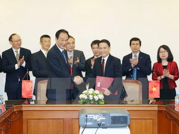 Signature d’un accord de coopération entre VNA et Xinhua ảnh 1 Signature d’un accord de coopération entre VNA et Xinhua ảnh 1