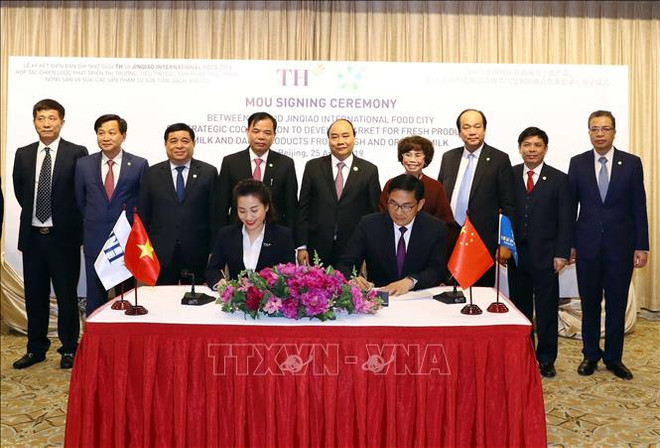 Le PM assiste à la signature d'un accord entre le groupe TH et son partenaire chinois ảnh 1 Le PM assiste à la signature d'un accord entre le groupe TH et son partenaire chinois ảnh 1