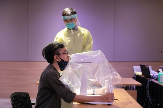 Singapour développe avec succès un robot d'échantillonnage du COVID-19 ảnh 1 Singapour développe avec succès un robot d'échantillonnage du COVID-19 ảnh 1