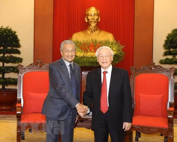 Le SG du Parti communiste et président du Vietnam reçoit le PM malaisien ảnh 1