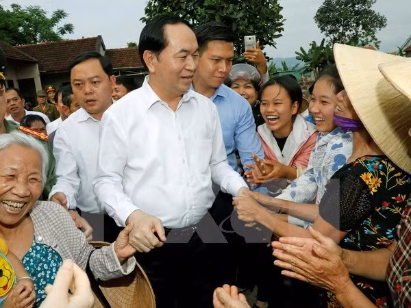 Le président Tran Dai Quang visite la commune de Nghia Dong, district de Tan Ky (Nghe An) ảnh 1
