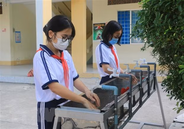 Les élèves de Ho Chi Minh-Ville retournent à l'école au début de mars ảnh 1