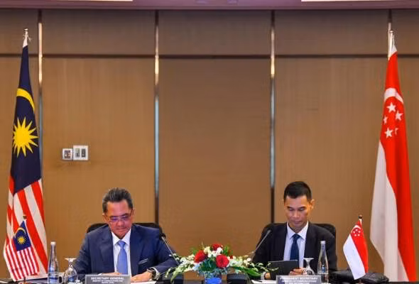 La Malaisie et Singapour renforcent leur coopération dans les domaines de la cybersécurité ảnh 1