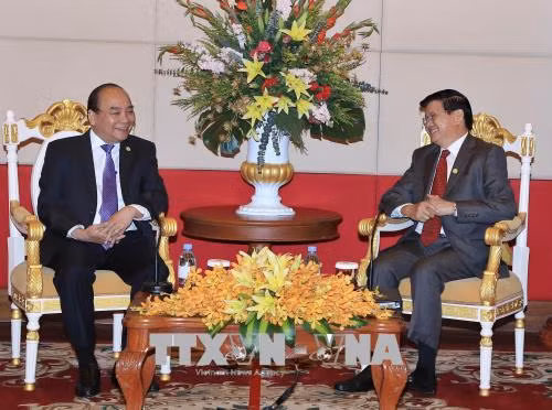 MRC : rencontre entre les Premiers ministres vietnamien et laotien ảnh 1