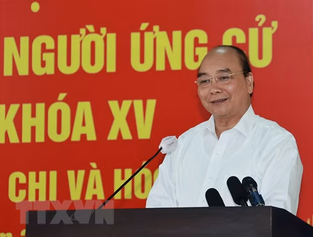 HCM-Ville: le président Nguyen Xuan Phuc reçoit des dignitaires religieux du district de Hoc Mon ảnh 1