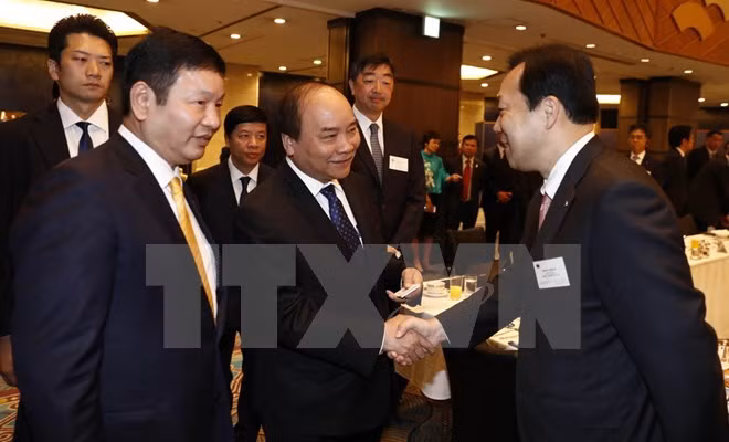 Le PM Nguyen Xuan Phuc au colloque avec les entreprises des TI du Japon ảnh 1