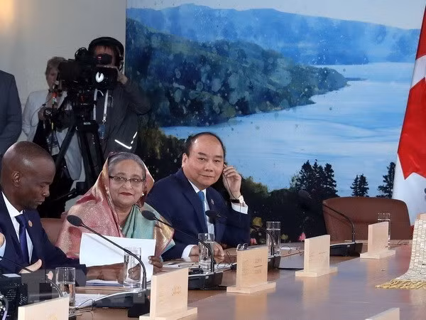 Un article de VNA sur la participation du Vietnam au Sommet du G7 élargi a publié au Canada ảnh 1