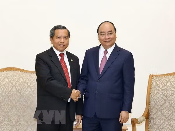 Le PM reçoit le ministre laotien des sciences et des technologies ảnh 1