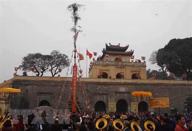Cây nêu – la perche rituelle du Têt ảnh 1