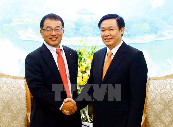 Le vice-PM Vuong Dinh Hue reçoit un responsable du groupe japonais Kirin ảnh 1