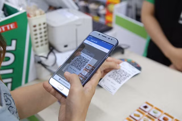 Promotion du paiement sans numéraire durant le Nouvel An lunaire ảnh 1