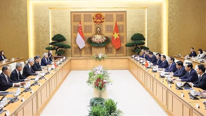 Le Vietnam et Singapour envisagent un partenariat stratégique intégral ảnh 2