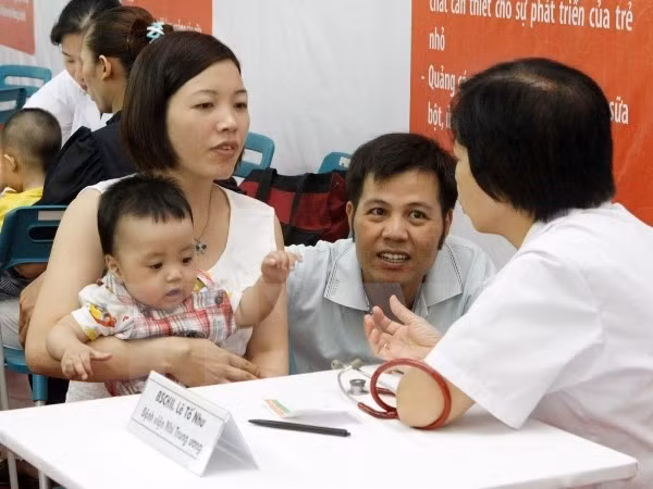 Colloque sur l'application de la loi sur l'assurance sociale de 2014 ảnh 1