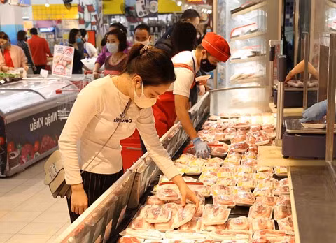 Big C lance sa campagne promotionnelle pour stabiliser les prix de la viande de porc ảnh 1