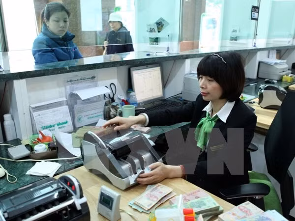 Vietcombank cédera 7,73% de son capital à un partenaire de Singapour ảnh 1