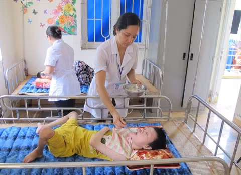Aujourd'hui, les victimes vietnamiens de l'agent orange sont de la 2e, 3e, mais aussi de la 4e génération. Photo : VNA