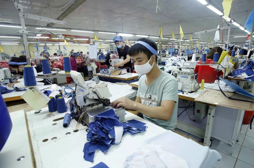 Production dans une usine. Photo: VNA