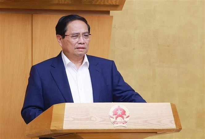 Le Premier ministre, Pham Minh Chinh s'exprime lors de la réunion. Photo: VNA