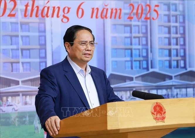 Le Premier ministre Pham Minh Chinh s'exprime lors de la conférence. Photo: VNA