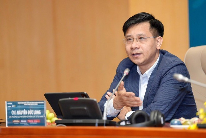 Nguyên Duc Long, directeur du Département de supervision des établissements de crédit, partage son point de vue lors du séminaire. Photo : VietnamPlus z6510029991802-139e73eed5e60ed378754eb901aec753.jpg