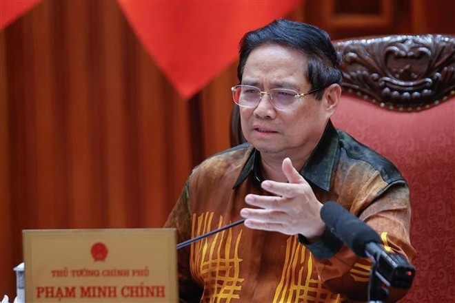 Le Premier ministre Pham Minh Chinh, chef du Comité de pilotage des centres financiers régionaux et internationaux au Vietnam. Photo : VNA vna-potal-thu-tuong-chu-tri-cuoc-hop-ve-trung-tam-tai-chinh-quoc-te-tai-viet-nam-8048273.jpg