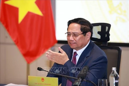 Le Premier ministre Pham Minh Chinh préside la réunion. Photo : VNA